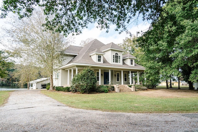 view of front facade with a porch and a front lawn