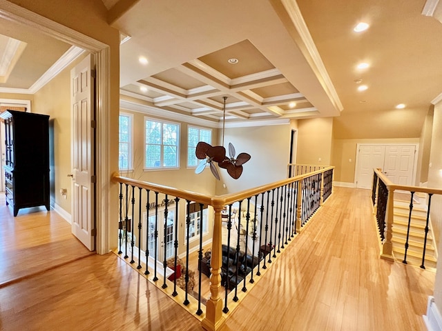 hall featuring beam ceiling, crown molding, wood-type flooring, and coffered ceiling