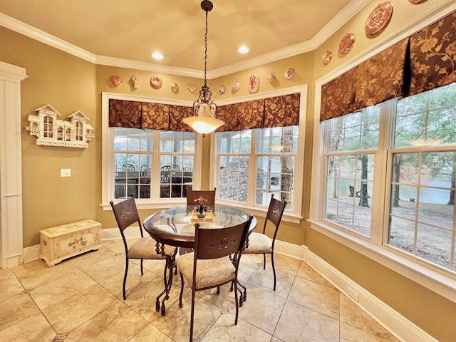 dining area featuring tile patterned floors and crown molding