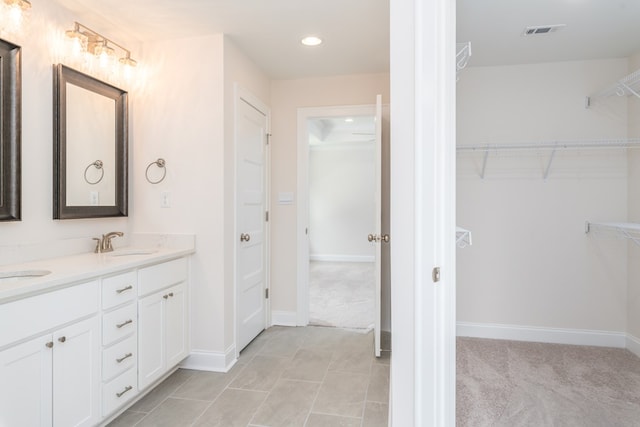 bathroom featuring tile patterned floors and vanity