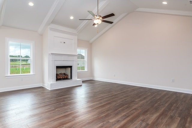 unfurnished living room with dark wood-type flooring, plenty of natural light, and lofted ceiling with beams