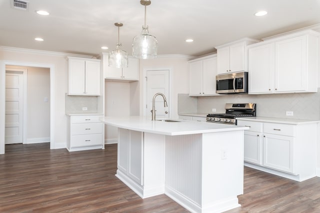 kitchen with white cabinets, sink, stainless steel appliances, and dark wood-type flooring