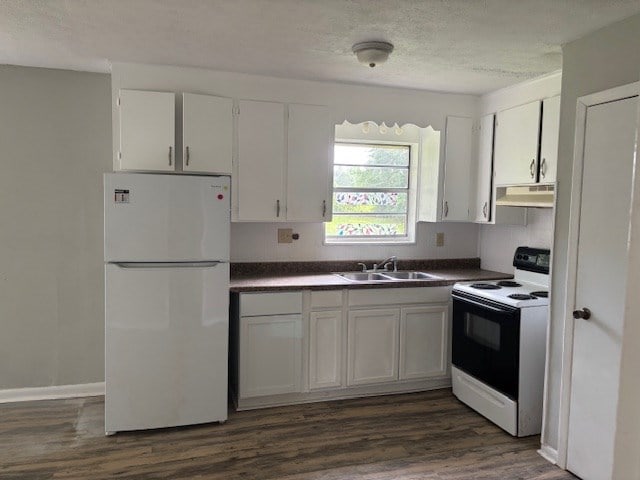 195 Donnie Mae Dr, Dothan, AL 36301 - kitchen featuring white appliances, under cabinet range hood, dark countertops, white cabinetry, and a textured ceiling