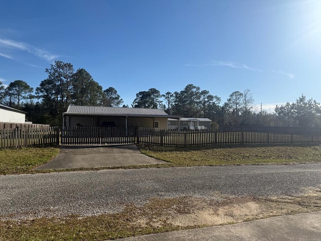 244 Cove Dr, Abbeville, AL 36310 - view of front of home featuring a fenced front yard and metal roof