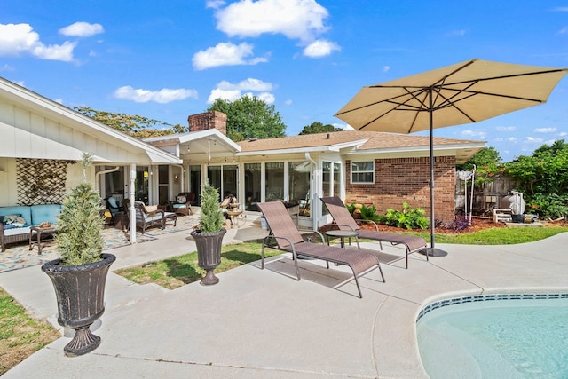 13215 E State Highway 52, Hartford, AL 36344 - back of house featuring an outdoor hangout area, a patio area, brick siding, and a chimney