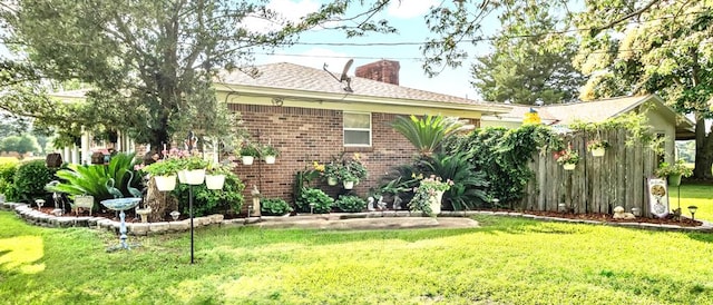 13215 E State Highway 52, Hartford, AL 36344 - rear view of property with a lawn, a chimney, and brick siding