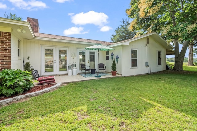 13215 E State Highway 52, Hartford, AL 36344 - back of house with french doors, a chimney, a yard, and a patio area