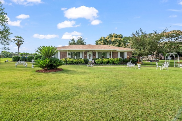 13215 E State Highway 52, Hartford, AL 36344 - ranch-style house featuring a front yard and brick siding