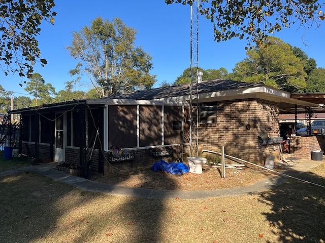 back of house with a sunroom