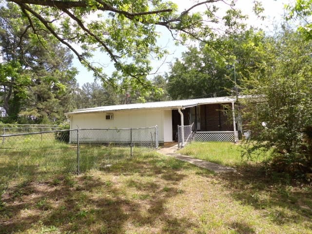 back of property with fence
