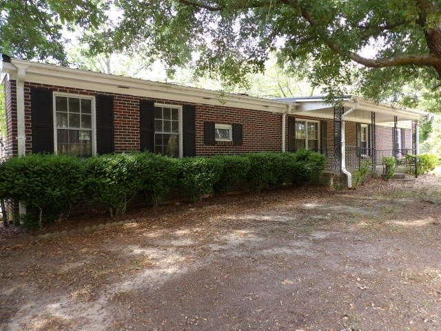 ranch-style house with brick siding
