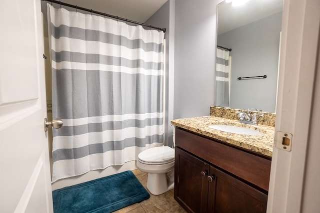 bathroom featuring vanity, a shower with shower curtain, tile patterned flooring, and toilet