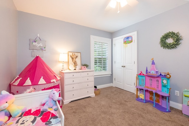 bedroom featuring a closet, baseboards, carpet, and a ceiling fan