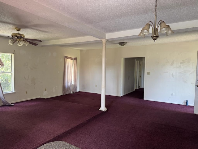 unfurnished room featuring baseboards, a textured ceiling, carpet floors, ornate columns, and ceiling fan with notable chandelier