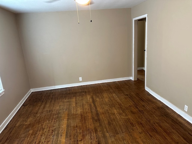 unfurnished room with ceiling fan and dark hardwood / wood-style floors