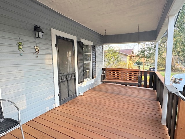 wooden deck featuring covered porch