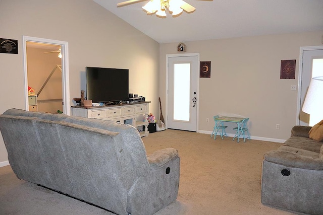 living room featuring vaulted ceiling, light carpet, a ceiling fan, and baseboards