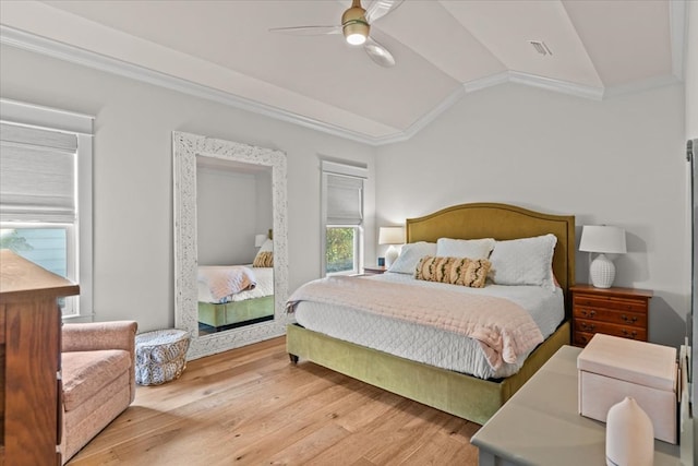 bedroom featuring crown molding, a ceiling fan, vaulted ceiling, and wood finished floors
