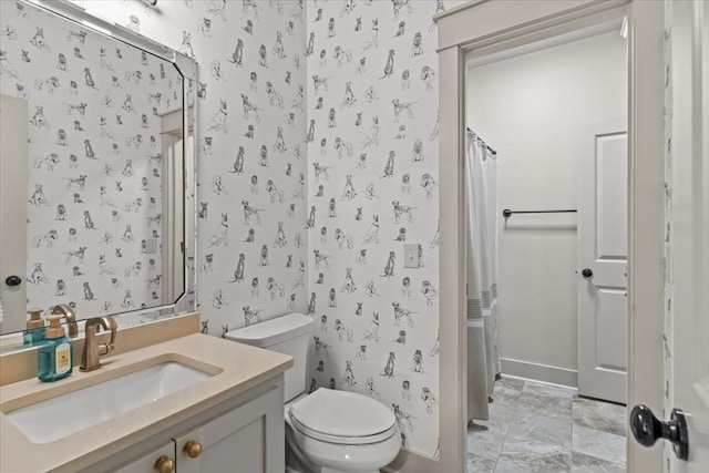 bathroom featuring vanity, marble finish floor, a shower with shower curtain, and toilet