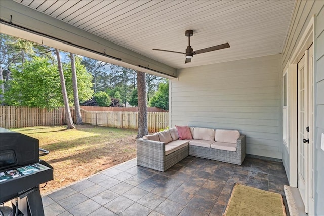 view of patio / terrace featuring a fenced backyard, a ceiling fan, grilling area, and outdoor lounge area