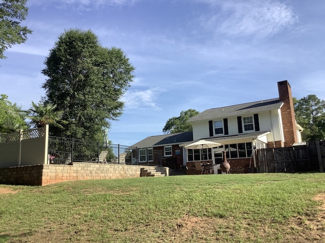 210 E Hickory Bend Rd, Enterprise, AL 36330 - back of property featuring a chimney and brick siding