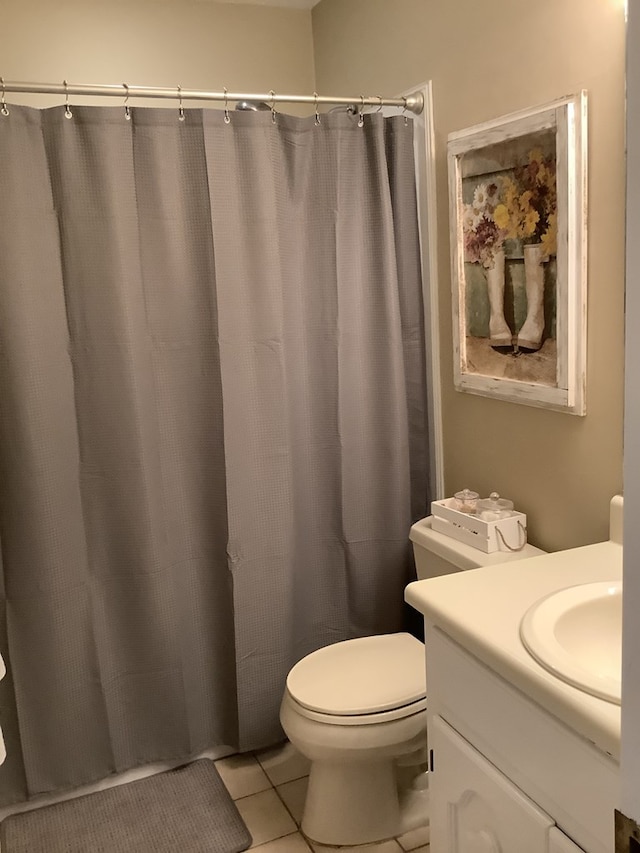 210 E Hickory Bend Rd, Enterprise, AL 36330 - bathroom featuring tile patterned floors, vanity, toilet, and a shower with shower curtain