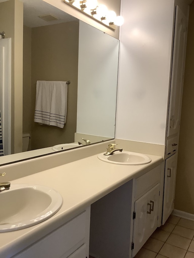 210 E Hickory Bend Rd, Enterprise, AL 36330 - bathroom featuring tile patterned flooring, double vanity, and toilet