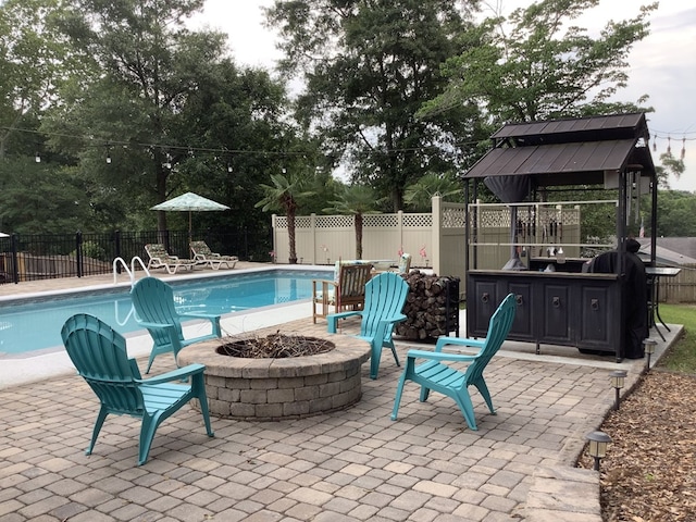 210 E Hickory Bend Rd, Enterprise, AL 36330 - view of pool with a fire pit, a patio, and a fenced backyard