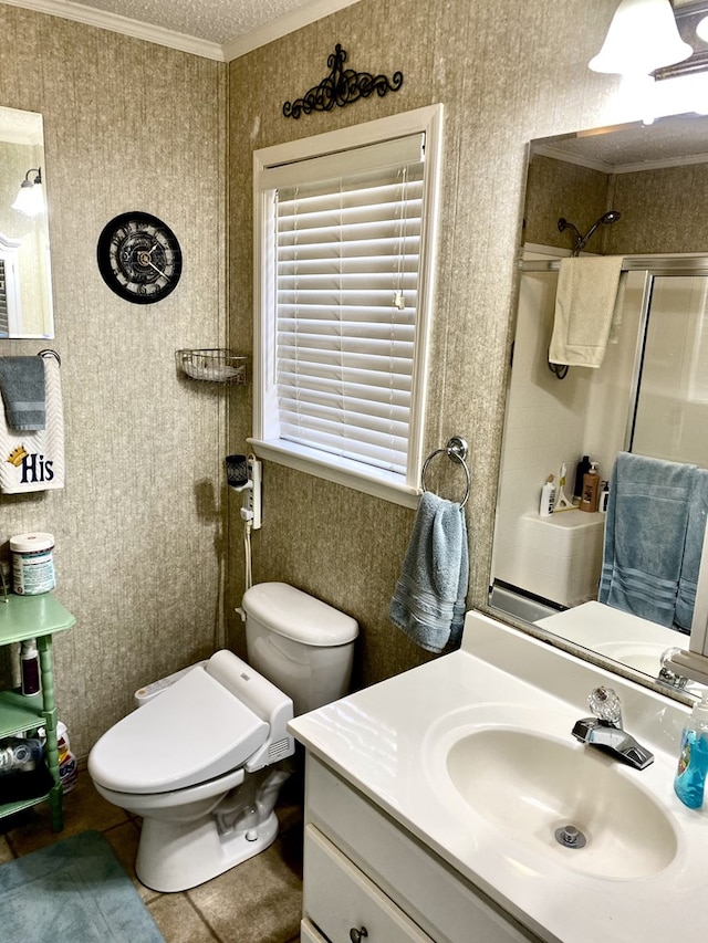 bathroom featuring walk in shower, tile patterned floors, crown molding, toilet, and vanity