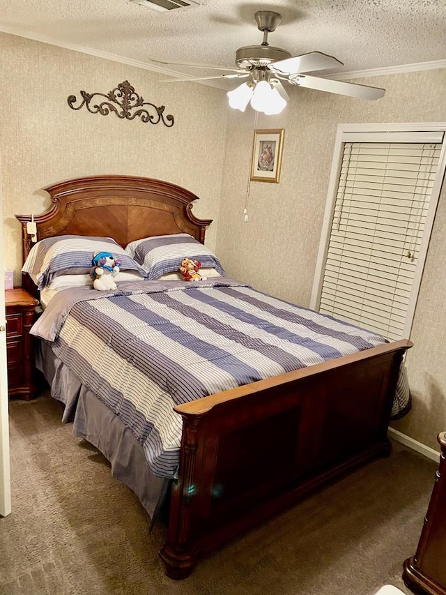 carpeted bedroom with ceiling fan, a textured ceiling, and ornamental molding