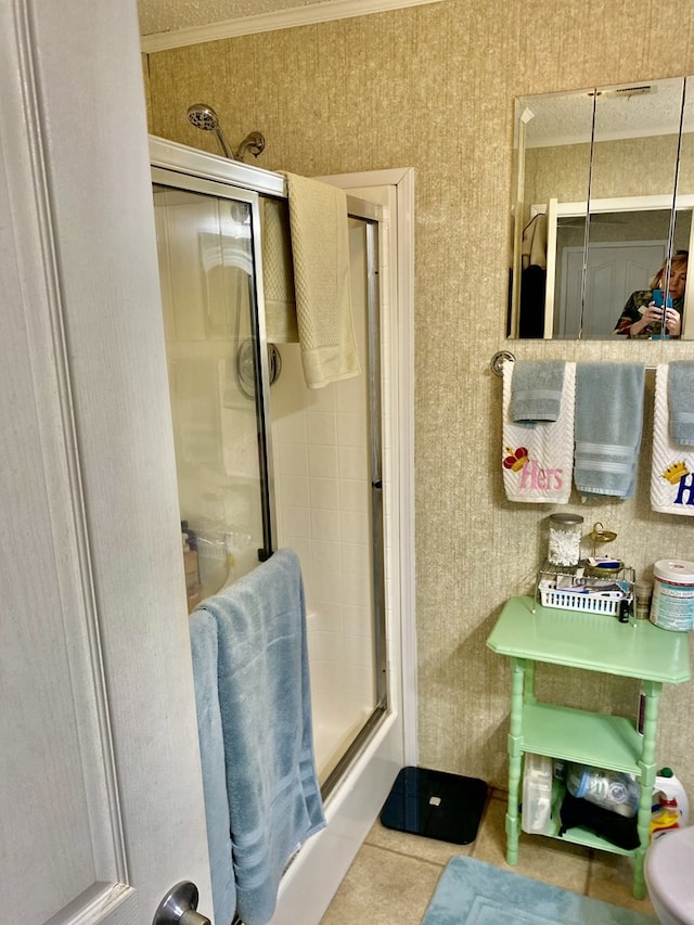 bathroom featuring tile patterned flooring and crown molding