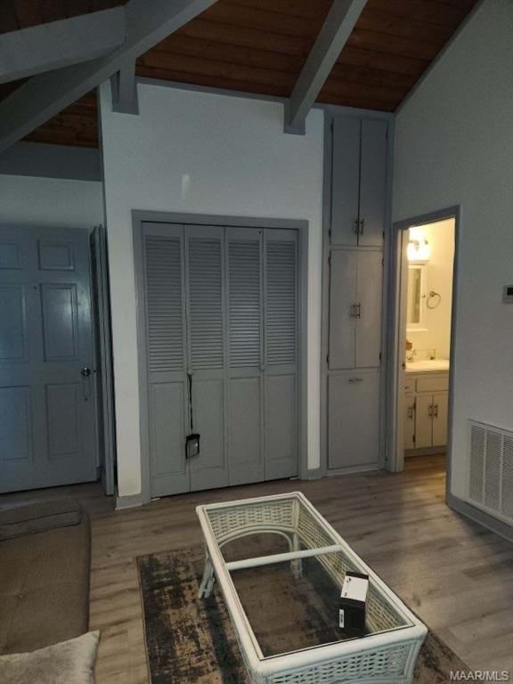 1442 Jernigan Rd, Ozark, AL 36360 - living area featuring light wood-type flooring, a wood ceiling with exposed beams, and high vaulted ceiling