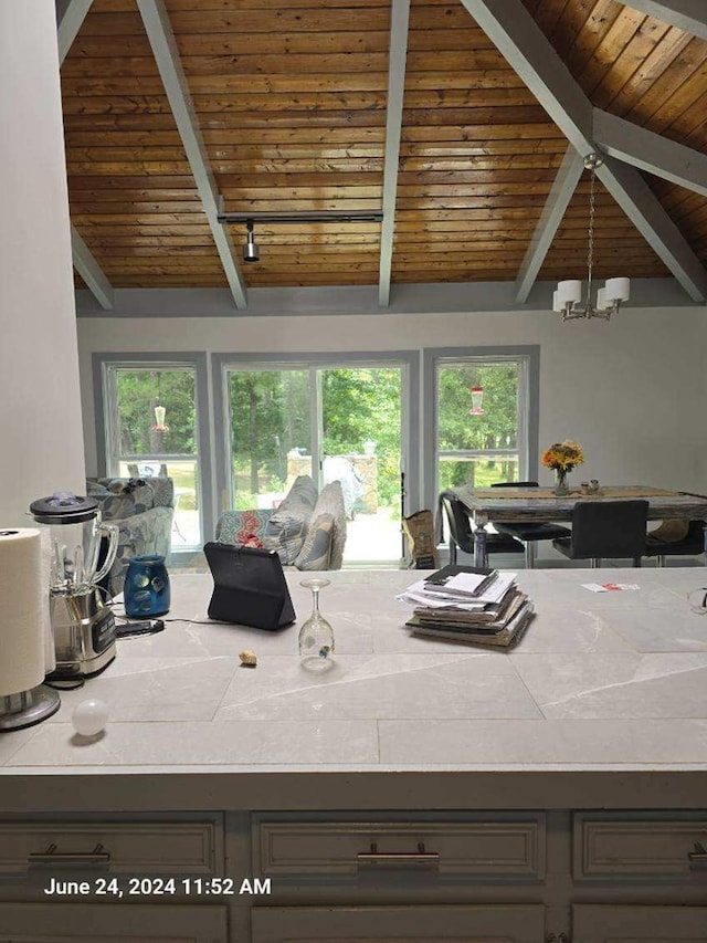 1442 Jernigan Rd, Ozark, AL 36360 - kitchen with wood ceiling, tile countertops, and plenty of natural light