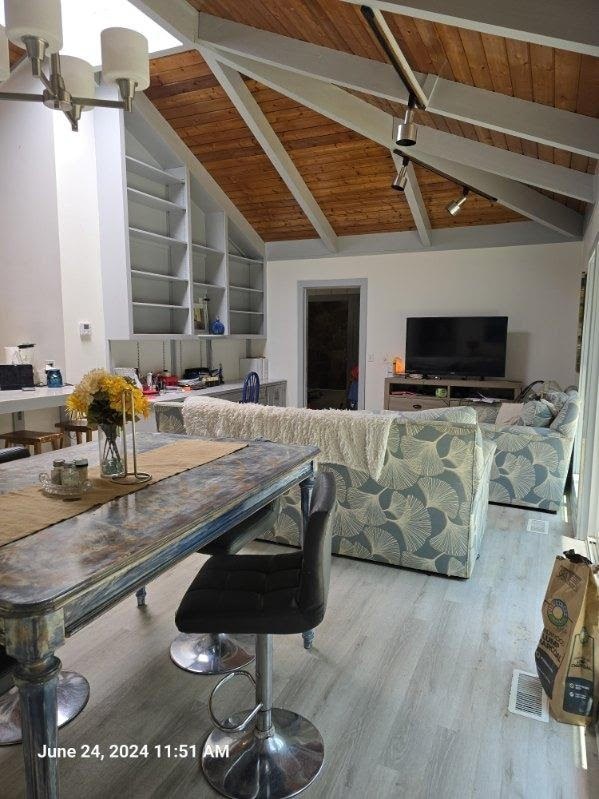 1442 Jernigan Rd, Ozark, AL 36360 - living room with wood ceiling and wood finished floors