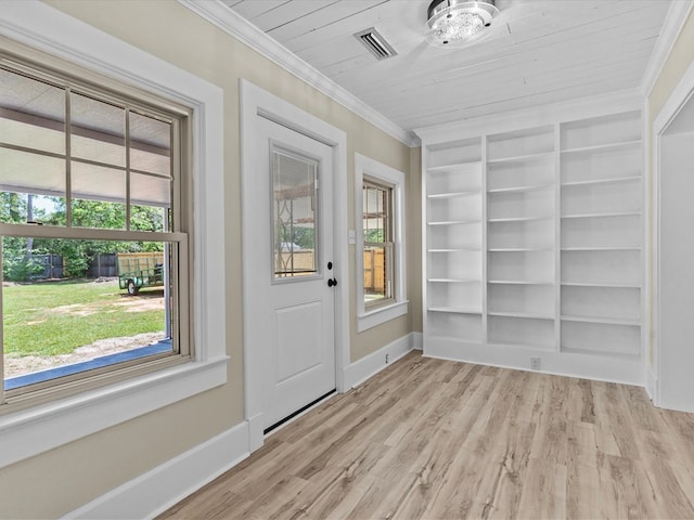 203 E Mckinnon St, New Brockton, AL 36351 - doorway featuring ornamental molding, built in shelves, and light wood finished floors