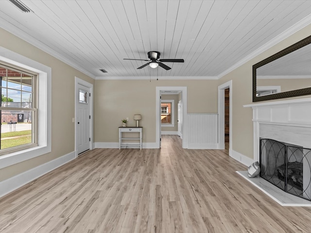 203 E Mckinnon St, New Brockton, AL 36351 - unfurnished living room with ornamental molding, light wood finished floors, a fireplace with raised hearth, ceiling fan, and wooden ceiling