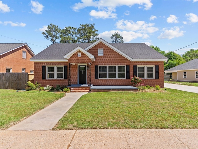 203 E Mckinnon St, New Brockton, AL 36351 - view of front facade with brick siding and a shingled roof