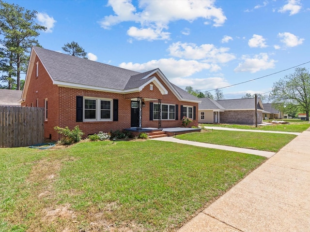 203 E Mckinnon St, New Brockton, AL 36351 - view of front of home with brick siding and roof with shingles