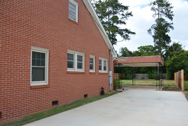 203 E Mckinnon St, New Brockton, AL 36351 - view of home's exterior featuring crawl space, driveway, and brick siding