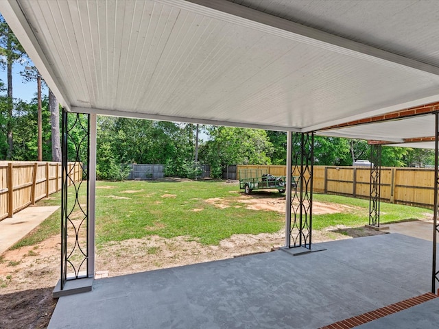 203 E Mckinnon St, New Brockton, AL 36351 - fenced backyard featuring a patio area