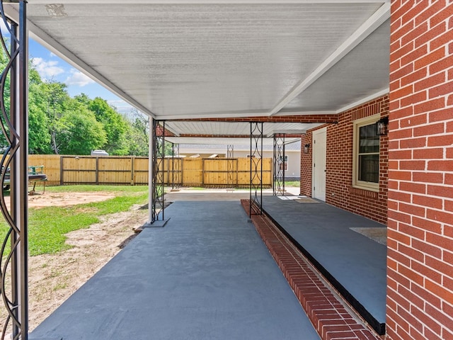 203 E Mckinnon St, New Brockton, AL 36351 - fenced backyard with a patio area