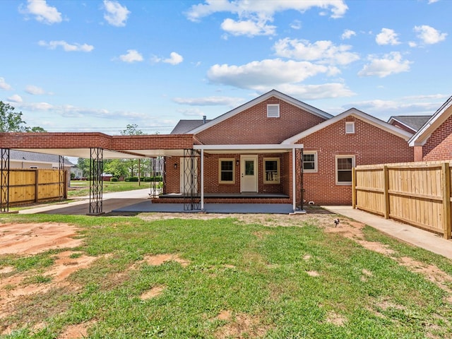 203 E Mckinnon St, New Brockton, AL 36351 - rear view of house with brick siding