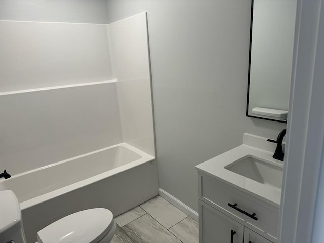 bathroom with marble finish floor, shower / tub combination, vanity, and toilet