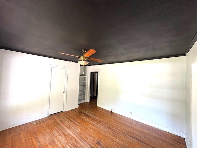 176 Camilla Ave, Ozark, AL 36345 - unfurnished bedroom featuring wood finished floors, baseboards, and a ceiling fan