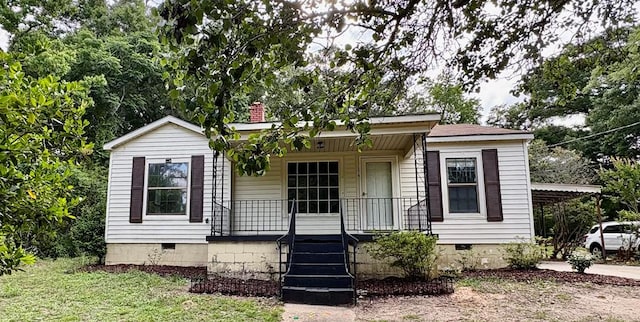 176 Camilla Ave, Ozark, AL 36345 - view of front of property featuring crawl space, a porch, and a chimney