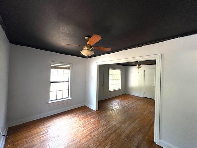176 Camilla Ave, Ozark, AL 36345 - empty room featuring ceiling fan, baseboards, and hardwood / wood-style floors