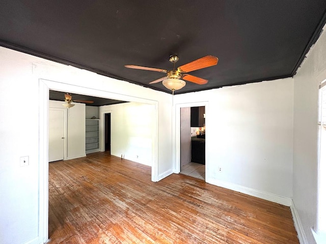 176 Camilla Ave, Ozark, AL 36345 - unfurnished room featuring a ceiling fan, wood-type flooring, and baseboards