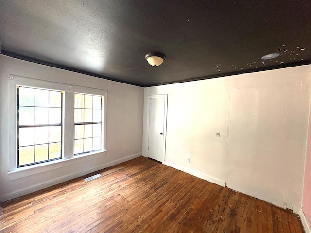 176 Camilla Ave, Ozark, AL 36345 - empty room with hardwood / wood-style flooring and baseboards