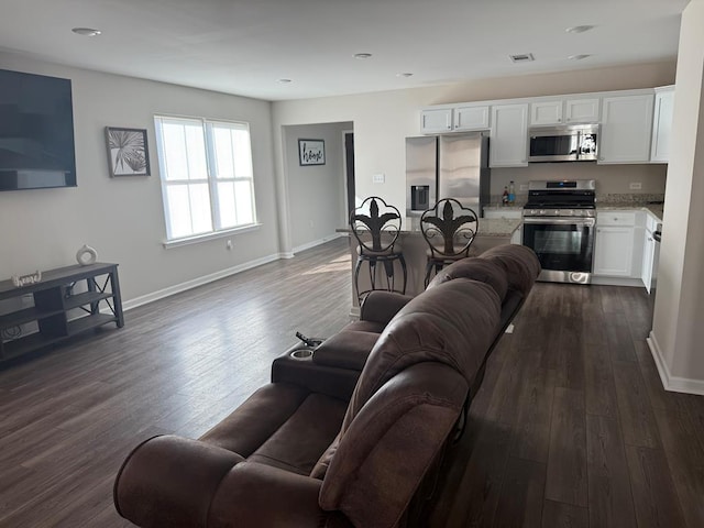 living room featuring dark hardwood / wood-style floors