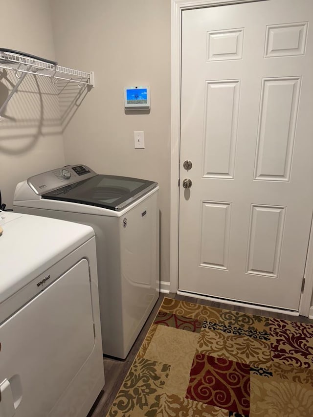 laundry area featuring washing machine and clothes dryer